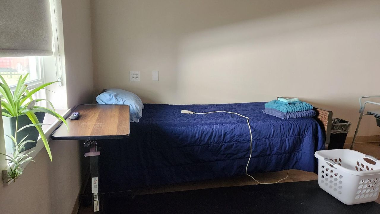 A respite room with a bed.