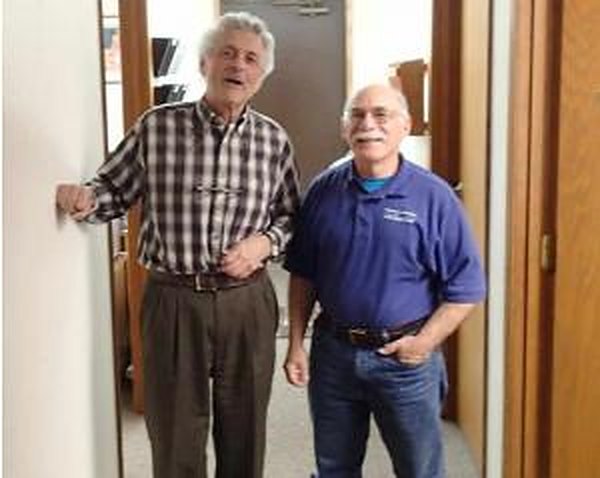 Two OPCC volunteers in the clinic hallway.